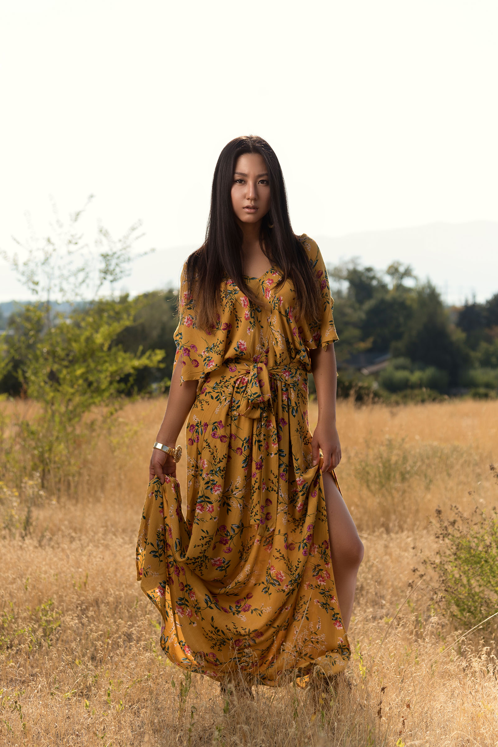 Cinematic editorial portrait of a female model on location, inspired by the safari, by Christopher Loke.